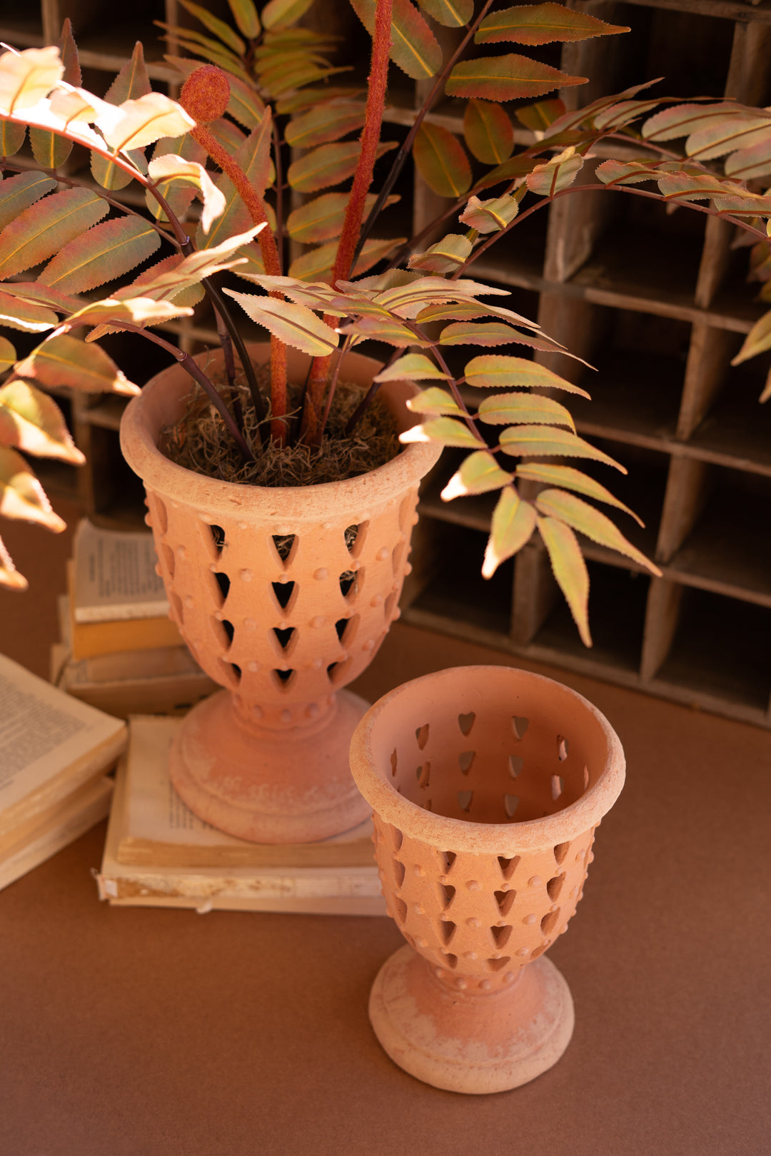 Set of 2 Concrete Perforated Urns with Terracotta Finish