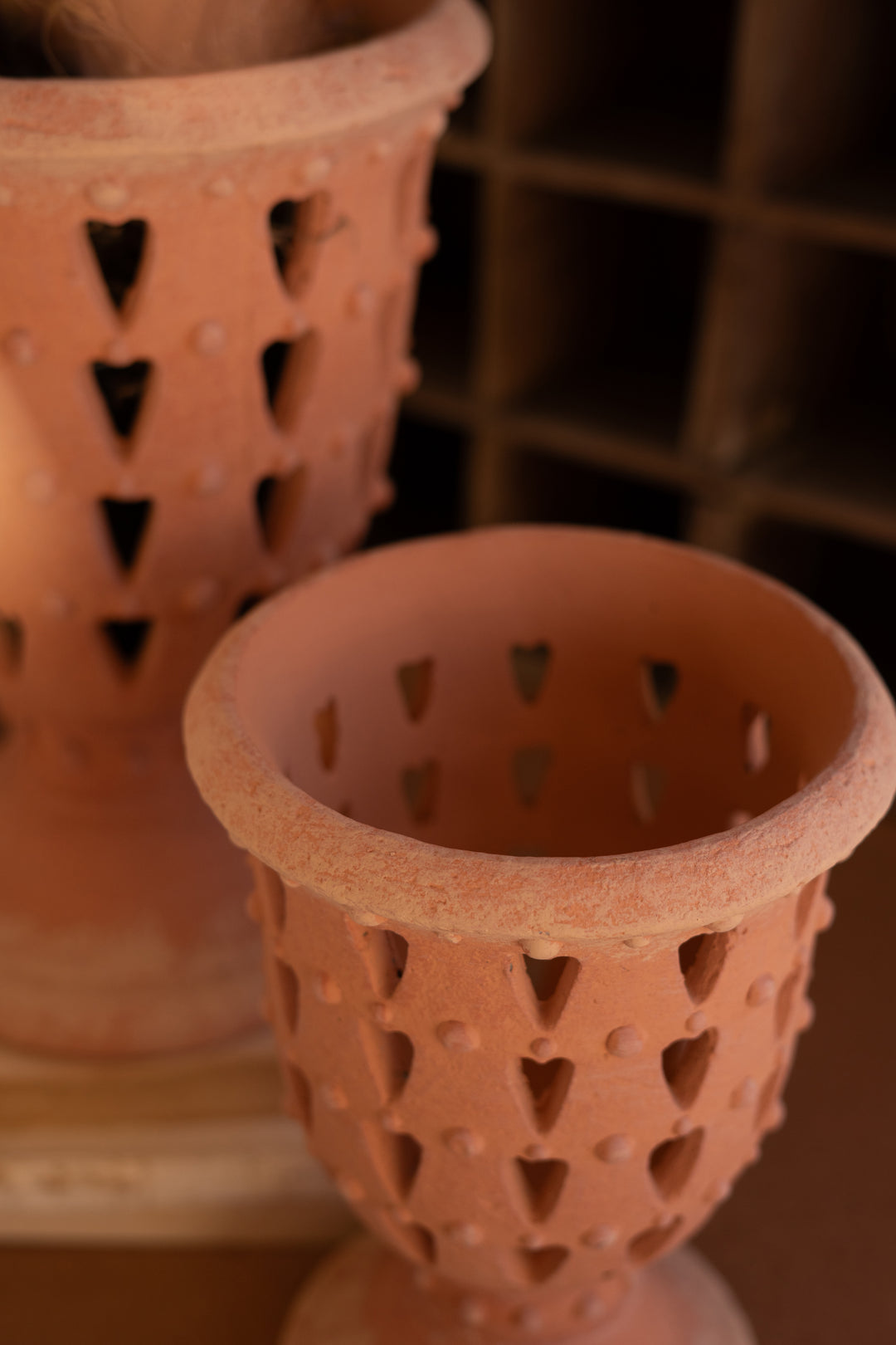 Set of 2 Concrete Perforated Urns with Terracotta Finish