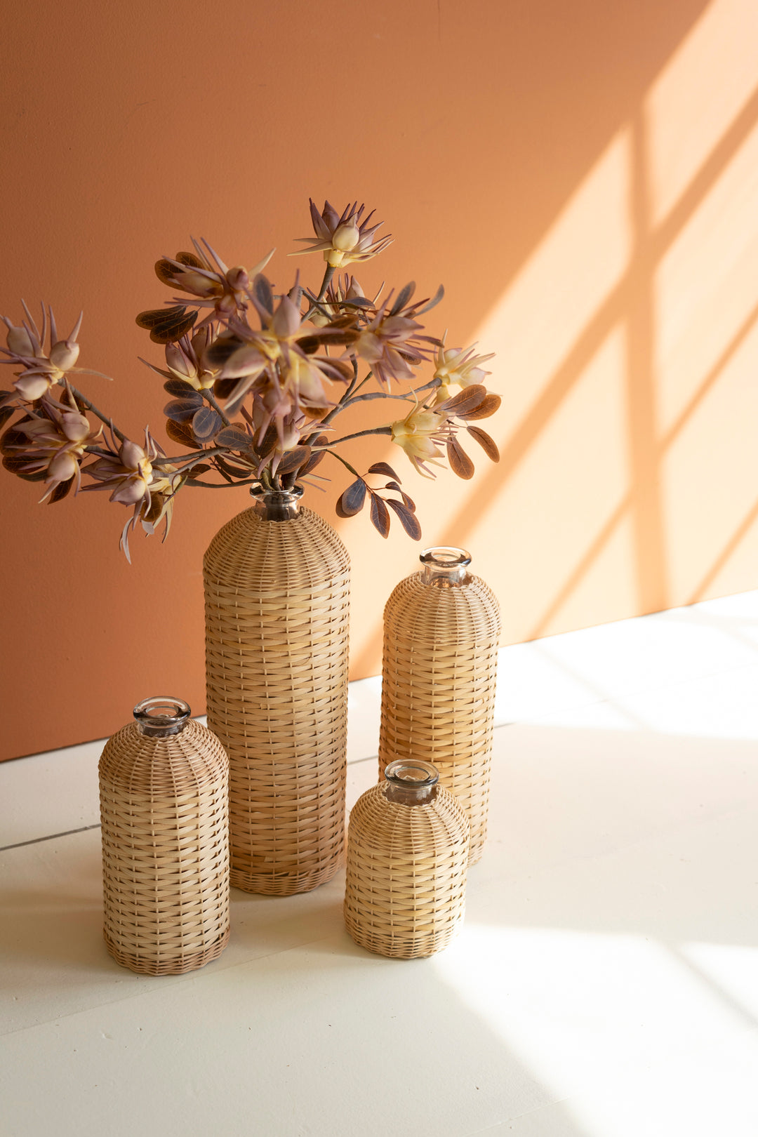 Set Of 4 Rattan Wrapped Glass Vases