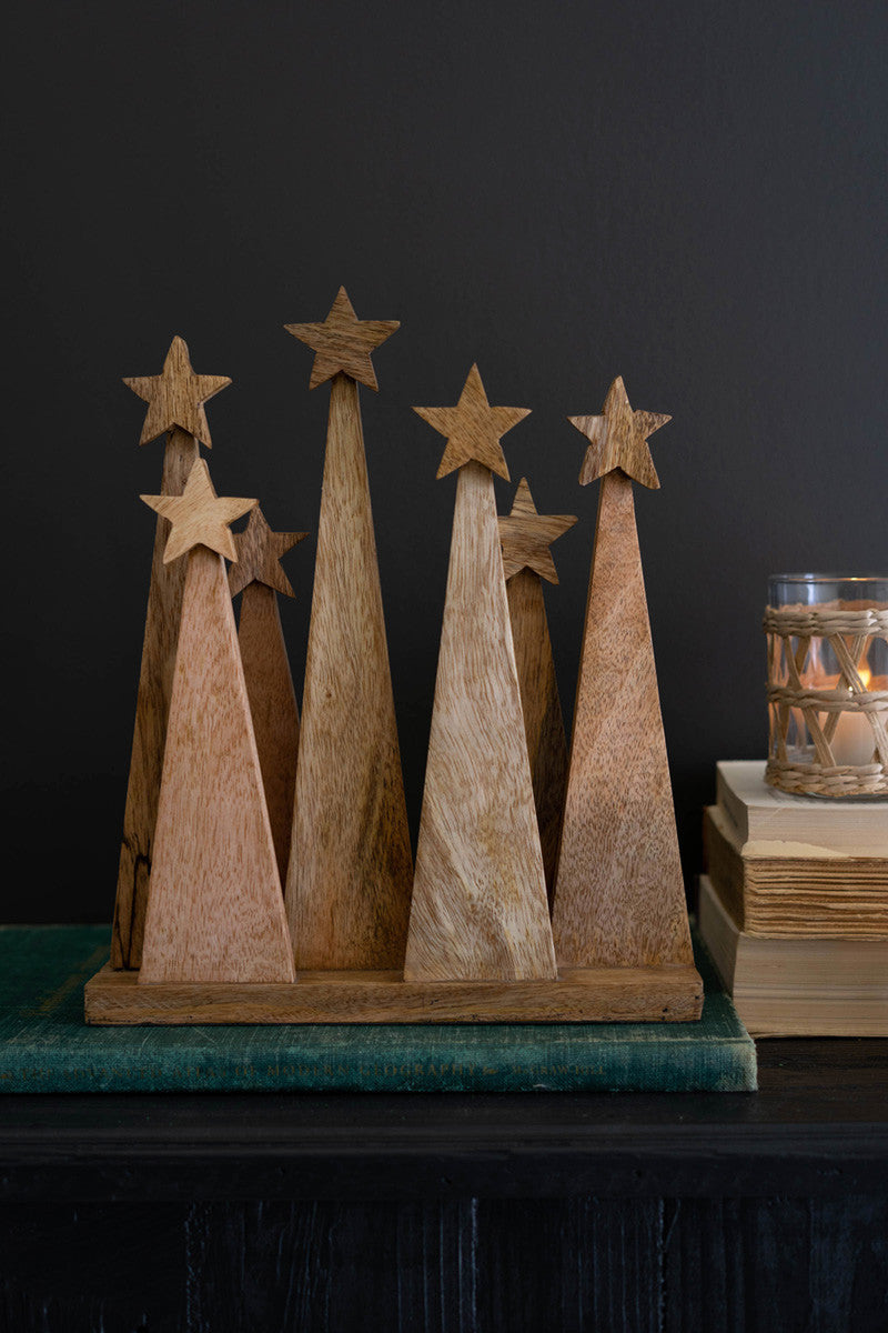 Seven Wooden Christmas Trees On A Base